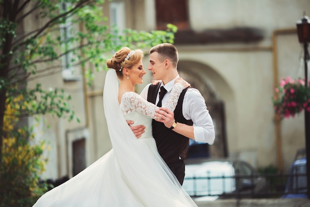 Incredible young wedding couple of the morning city.Walk in the wedding day