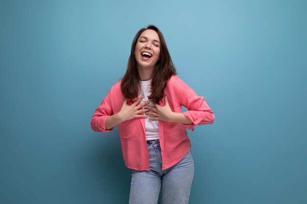 Incredibly smiling happy young lady in a stylish summer look on a studio isolated background