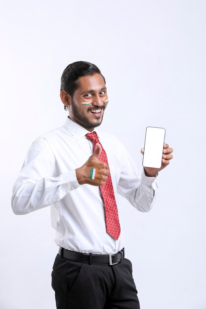 Independence day offer concept : Young indian showing smartphone.