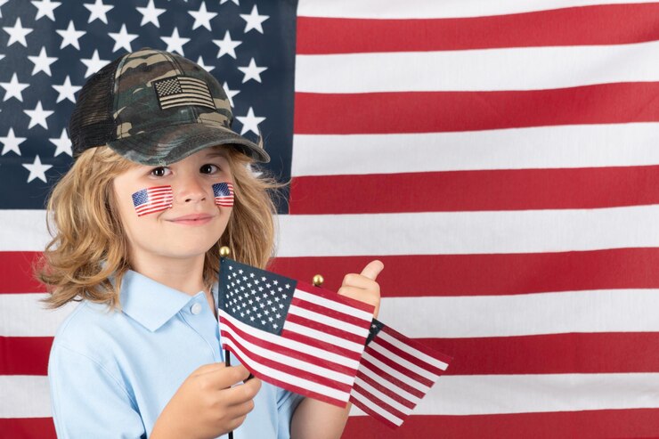 Independence day th of july child with american flag american flag on kids cheek usa freedom concept