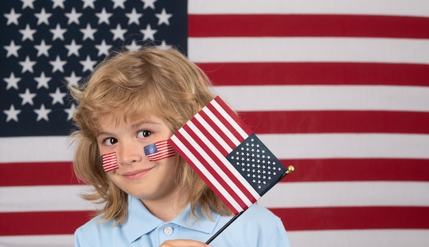 Independence day th of july close up portrait of child with usa flag on cheek