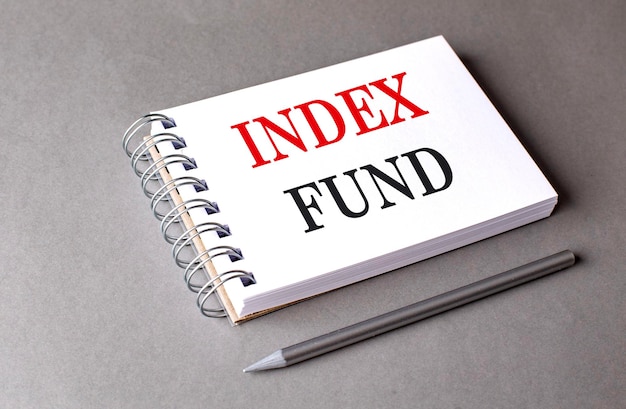INDEX FUND text on notebook on grey background