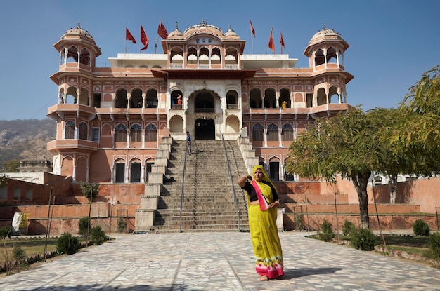 India, Rajasthan, Jaipur; 24 january 2007, indian people at the entrance of a Hindu Temple near the Sisodia Rani Ka Bagh Palace - EDITORIAL