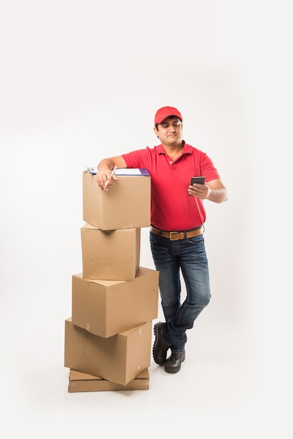 Indian or Asian Handsome Delivery Man with Box and Check List, isolated