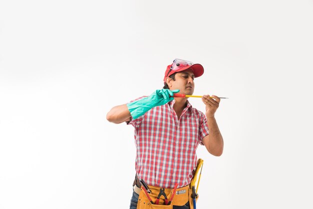 Indian asian handsome electrician or engineer with tools standing isolated