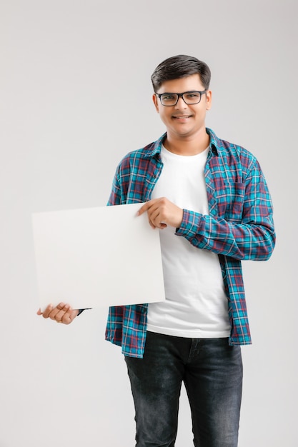  Indian, Asian Young Man showing blank signboard