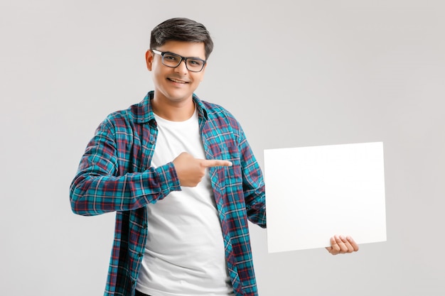  Indian, Asian Young Man showing blank signboard