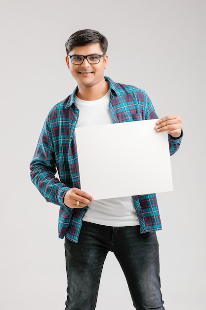  Indian, Asian Young Man showing blank signboard