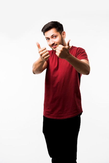 Indian asian young man showing thumbs up or ok sign