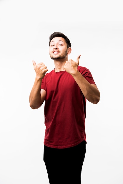 Indian asian young man showing thumbs up or ok sign