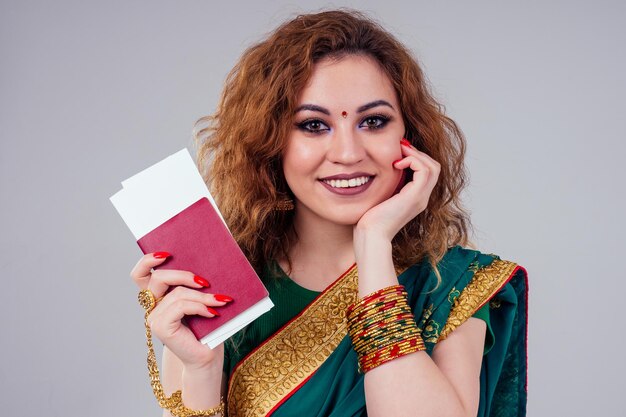 Indian beautiful fashion brunette woman in green traditional wedding rich sari