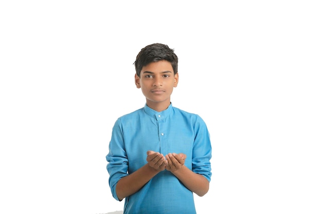 Photo indian boy in traditional wear and giving hand expression on white background