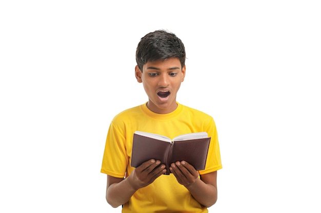 Indian boy with diary on white background.