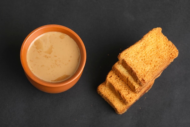 Indian breakfast. tea and rusk on white background.