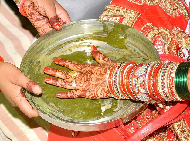 Indian bride hand print to cloth ritual ceremony