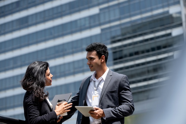 Indian businessman having outdoor meeting with client 