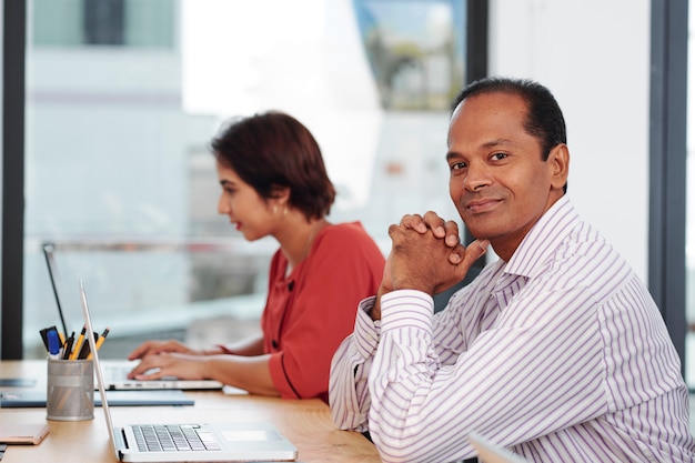 Indian businessman sitting at office