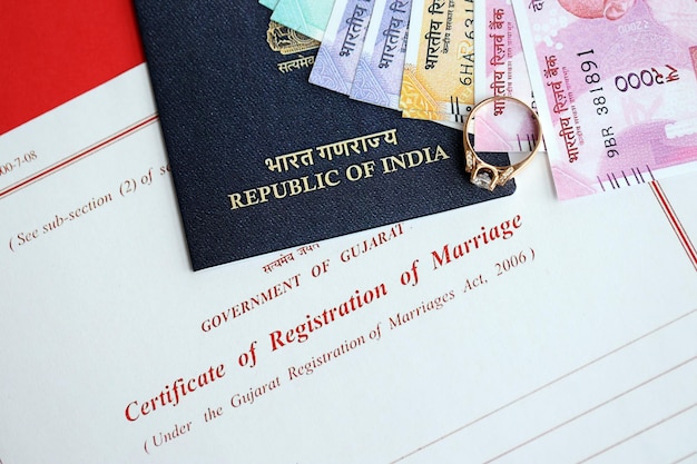 Photo indian certificate of registration of marriage blank document and wedding ring with rupiah money on