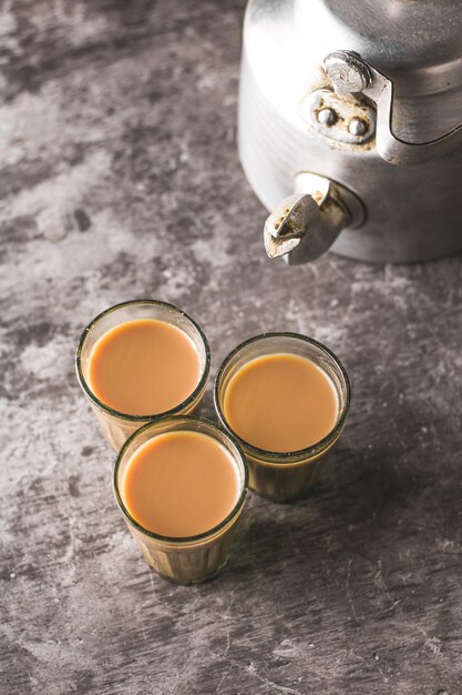 Indian chai in glass cups with masalas to make the tea