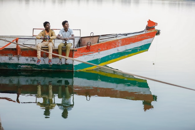 Indian child enjoy traveling in boat