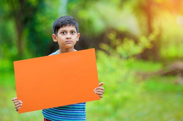 indian child holding empty poster