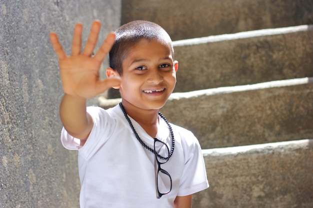 Indian child showing five fingers