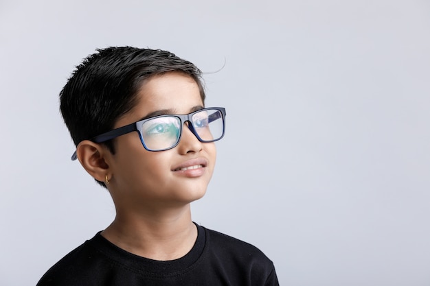 Indian child wearing spectacles isolated