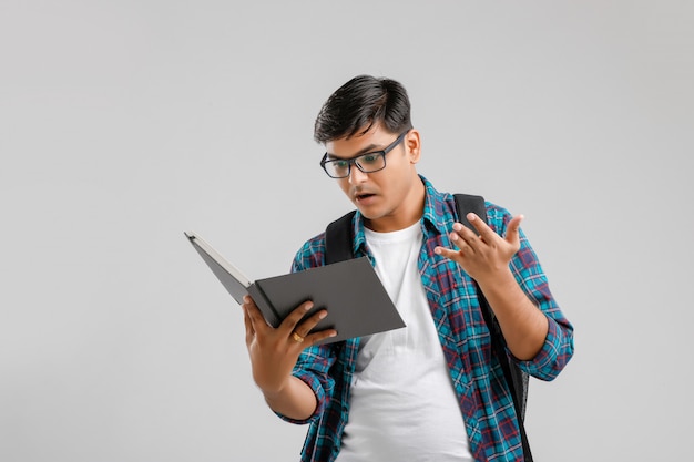 Indian college boy reading