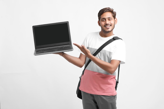 Indian college student showing laptop screen