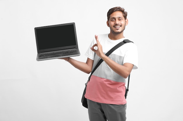 Indian college student showing laptop screen