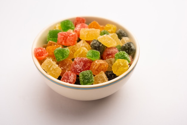 Indian colorful candy and jelly bites sweet, fruit flavoured confectionery coated with sugar, served in a plate or bowl