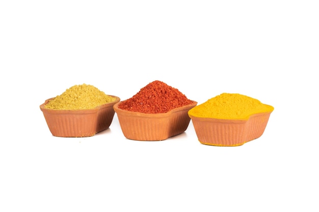 Indian Colourful Spices Also Know as Red Chilli Powder, Turmeric Powder, Coriander Powder, Mirchi, Mirch, Haldi, Dhaniya Powder Isolated on White Background