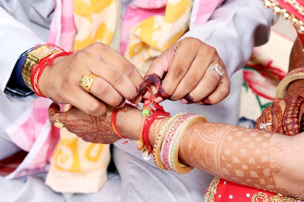 Indian couple playing Ring Fishing game in wedding ceremony of India