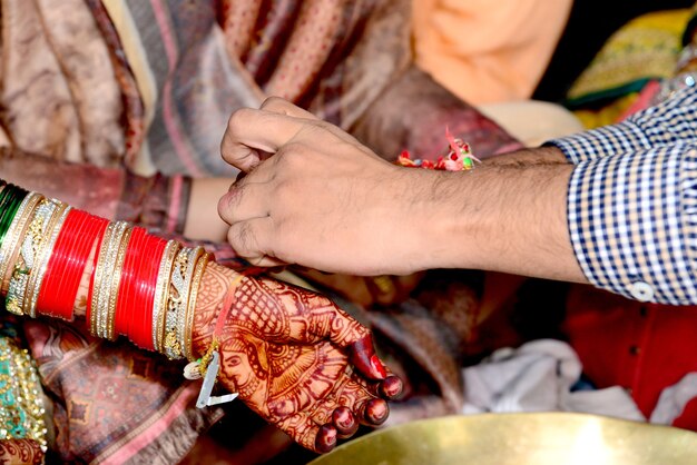 Indian couple playing Ring Fishing game in wedding ceremony of India