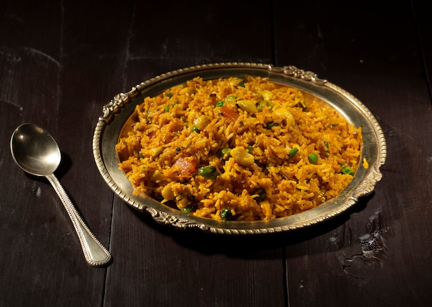 Indian Cuisine Food Kashmiri Pulao on Wooden