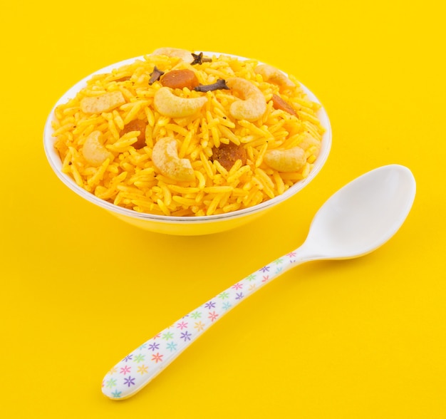 Indian Cuisine Pulao on Yellow Background