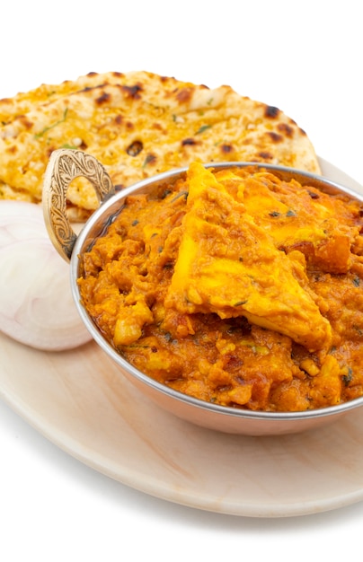 Indian Cuisine Special Sweet And Spicy Paneer Pasanda Served With Garlic Naan on White Background