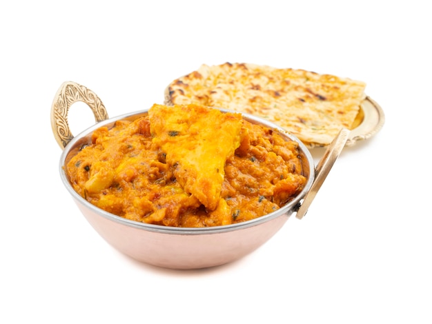 Indian Cuisine Sweet And Spicy Paneer Pasanda Served With Garlic Naan on White Background