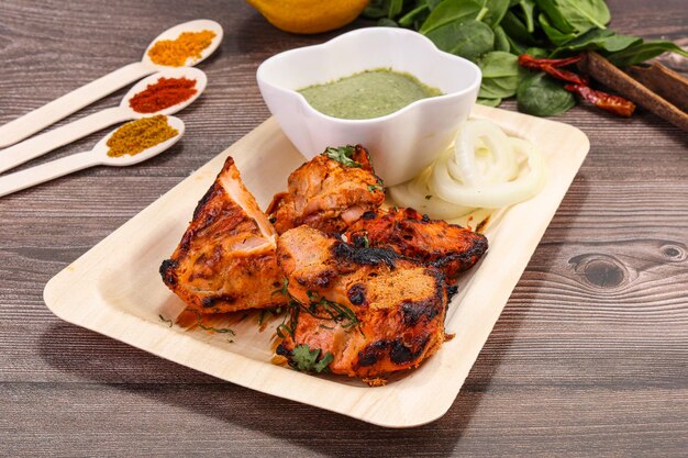 Indian cuisine tandoori chicken tikka grilled meat with spices