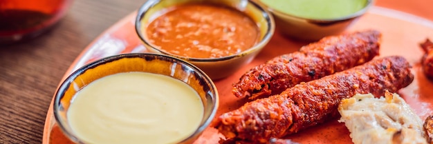 Indian cuisinefamous indian mutton or lamb curry dish in a cast iron cookware selective focus