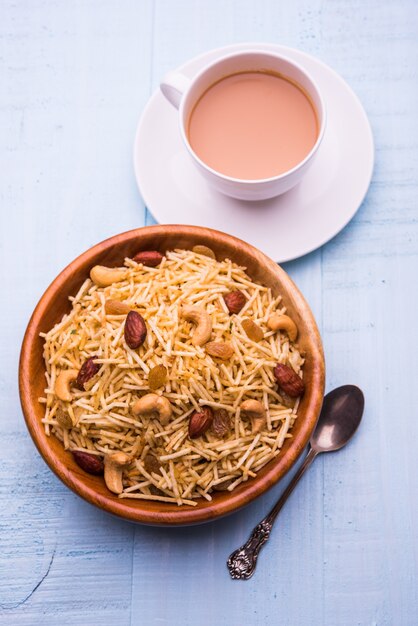 Indian deep fried Falahari chivda also known as Fasting or Upwas chiwada made using potato and dry fruits for Navaratri or any hindu vrat. Served in a wooden bowl. Selective focus