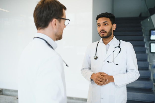 An Indian doctor with a European doctor colleague Multiracial team concept