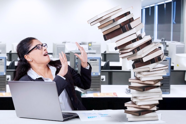 Indian employee and falling books