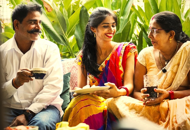 Indian family enjoying a snack