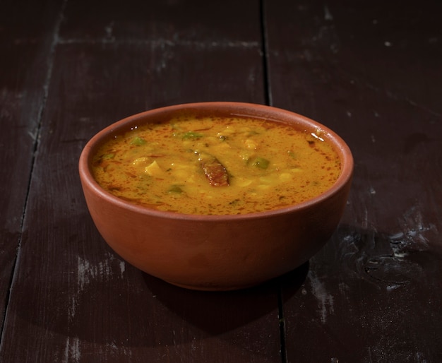 Indian Famous Cuisine Dal Tadka on Vintage Wooden Background