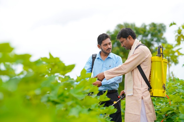 Indian farmer Discussing with agronomist at Farm and collecting some information