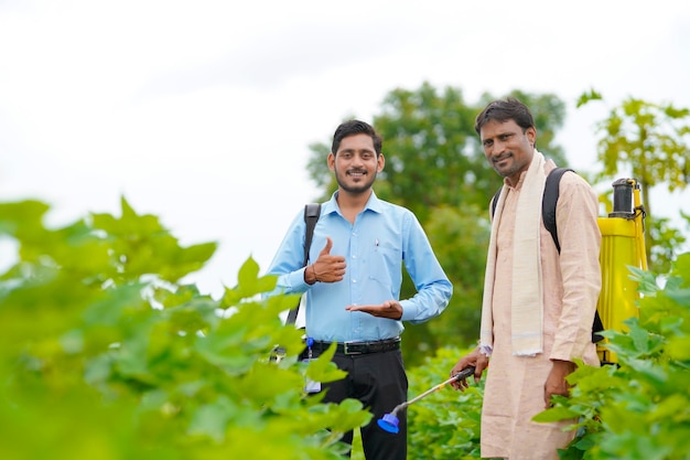 Indian farmer Discussing with agronomist at Farm and collecting some information