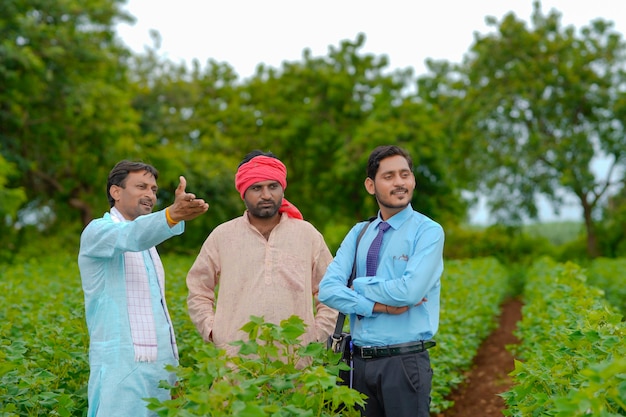 Indian farmer Discussing with agronomist at Farm and collecting some information