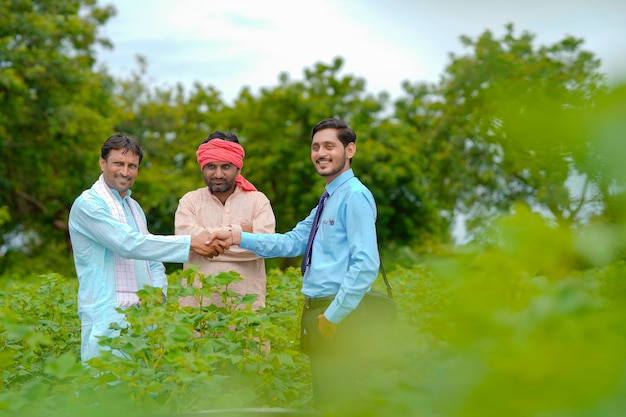 Indian farmer Discussing with agronomist at Farm and collecting some information