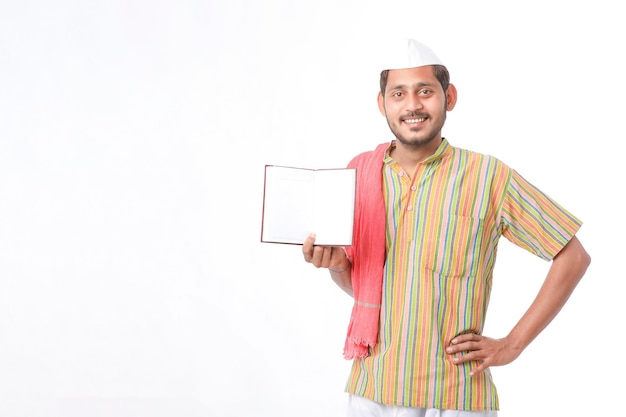 Photo indian farmer showing diary on white background.